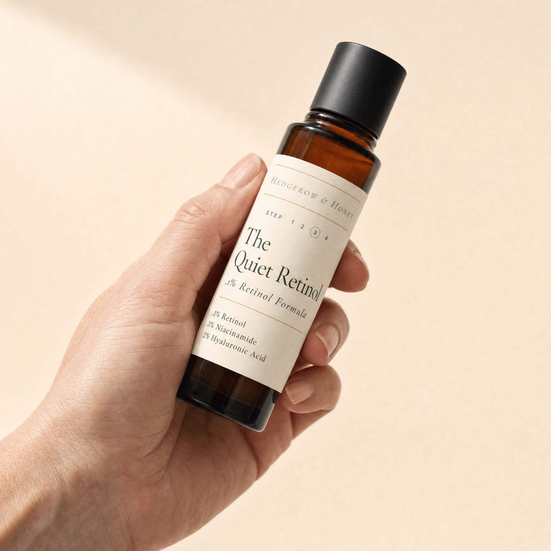 The Quiet Retinol bottle held in hand